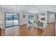 Open-concept living room with access to screened lanai, outdoor pool and fireplace at 134 Barrington Dr, Brandon, FL 33511