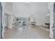 Open-concept living room with tile floors, a view of the pool, and an adjacent dining area at 134 Barrington Dr, Brandon, FL 33511