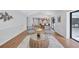 Open-concept living room with access to kitchen, screened lanai and bright natural light at 134 Barrington Dr, Brandon, FL 33511
