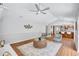 Open-concept living room with access to kitchen and bright natural light at 134 Barrington Dr, Brandon, FL 33511