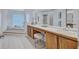 Main bathroom featuring dual sinks, a makeup counter, and a large soaking tub at 134 Barrington Dr, Brandon, FL 33511