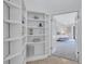 Bright main bedroom entryway features stylish built-in shelving and neutral decor at 134 Barrington Dr, Brandon, FL 33511