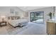 Light-filled main bedroom featuring slider door access to an outdoor patio at 134 Barrington Dr, Brandon, FL 33511