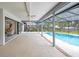 Enjoy the pool view from this covered and screened patio with ceiling fans at 134 Barrington Dr, Brandon, FL 33511