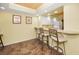 Basement bar featuring tile floor, neutral walls and bar stool seating at 1340 Gulf Blvd # 8C, Clearwater Beach, FL 33767