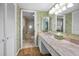 Bathroom featuring an extended countertop with a peek into the bath tub and toilet at 1340 Gulf Blvd # 8C, Clearwater Beach, FL 33767