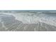 White sand beach with gentle waves rolling in at 1340 Gulf Blvd # 8C, Clearwater Beach, FL 33767