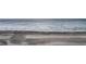 A view of the beach showing sand, surf and people enjoying the day at 1340 Gulf Blvd # 8C, Clearwater Beach, FL 33767
