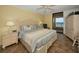Bedroom with ocean view, ceiling fan, and neutral tones providing a relaxing atmosphere at 1340 Gulf Blvd # 8C, Clearwater Beach, FL 33767