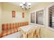 Cozy dining area with a chandelier and a window, creating a bright and inviting space for meals at 1340 Gulf Blvd # 8C, Clearwater Beach, FL 33767