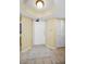 Bright entryway features tile floors, a decorative rug, a white door and a closet at 1340 Gulf Blvd # 8C, Clearwater Beach, FL 33767