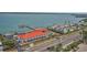 Exterior view of condominium complex with a waterfront view, boat access, and a secure gated entrance at 1340 Gulf Blvd # 8C, Clearwater Beach, FL 33767
