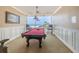 Clubhouse game room with billiards table, ocean views, and wainscoting at 1340 Gulf Blvd # 8C, Clearwater Beach, FL 33767