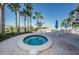 Community hot tub near the beach with tables, chairs and umbrellas at 1340 Gulf Blvd # 8C, Clearwater Beach, FL 33767