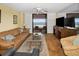 Bright living room with comfortable seating, and a large sliding glass door that leads to the balcony at 1340 Gulf Blvd # 8C, Clearwater Beach, FL 33767