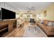 Bright and airy living room with tiled floors, comfortable seating and an adjacent kitchen at 1340 Gulf Blvd # 8C, Clearwater Beach, FL 33767