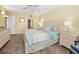 Bright main bedroom with tile flooring and adjacent bathroom at 1340 Gulf Blvd # 8C, Clearwater Beach, FL 33767