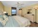 Comfortable main bedroom with view of balcony and ocean at 1340 Gulf Blvd # 8C, Clearwater Beach, FL 33767
