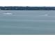 A tranquil water view showcasing a serene setting with a passing boat creating a sense of peacefulness at 1340 Gulf Blvd # 8C, Clearwater Beach, FL 33767