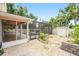 Backyard with patio, screened-in pool, and partial view of storage shed, creating an outdoor haven at 1517 60Th S St, Gulfport, FL 33707