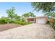 Cozy home with palm trees, a brick driveway, and a one-car garage, offering a welcoming curb appeal at 1517 60Th S St, Gulfport, FL 33707