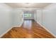 Open hallway with sleek wood floors, connecting the various living spaces in the home at 1517 60Th S St, Gulfport, FL 33707