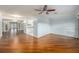 Open floor plan with wood floors, seamlessly connecting the living area and kitchen at 1517 60Th S St, Gulfport, FL 33707
