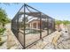 Screened-in pool featuring brick pavers and privacy walls, creating a private backyard oasis at 1517 60Th S St, Gulfport, FL 33707