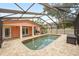 Screened-in pool area with brick pavers, offering a private and shaded outdoor retreat at 1517 60Th S St, Gulfport, FL 33707