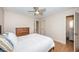 Bedroom with a ceiling fan and wood-look flooring, filled with natural light at 1700 Shore Acres Ne Blvd, St Petersburg, FL 33703