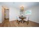 Charming dining area featuring stylish lighting, wainscoting, and space for hosting guests at 1700 Shore Acres Ne Blvd, St Petersburg, FL 33703