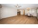 Bright living room and dining area offering an open concept floor plan and updated lighting at 1700 Shore Acres Ne Blvd, St Petersburg, FL 33703