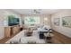 Bright living room featuring neutral colors, ceiling fan, modern furniture, and natural light at 1700 Shore Acres Ne Blvd, St Petersburg, FL 33703
