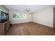 Minimalist living room with hardwood flooring, bright natural light, and fresh neutral paint at 1700 Shore Acres Ne Blvd, St Petersburg, FL 33703