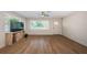 Spacious living room with hardwood floors, bright natural light, and an open airy feel at 1700 Shore Acres Ne Blvd, St Petersburg, FL 33703