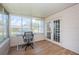 Sunroom with desk and lots of natural light at 1700 Shore Acres Ne Blvd, St Petersburg, FL 33703