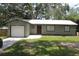 Charming single-story home featuring a one-car garage, metal roof, and freshly cut lawn at 208 Wilson Ave, Brooksville, FL 34601