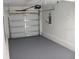 Spacious garage with fresh paint and ample room for parking and storage at 208 Wilson Ave, Brooksville, FL 34601