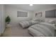 Comfortable bedroom with two twin beds and neutral decor at 2121 Dodge St, Clearwater, FL 33760