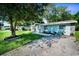 Well-manicured lawn and stone accents enhance this home's curb appeal with ample driveway parking at 2121 Dodge St, Clearwater, FL 33760