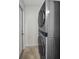 This laundry area has a modern stacked washer and dryer set, offering efficient laundry solutions at 2121 Dodge St, Clearwater, FL 33760