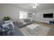 Bright living room with plush seating, neutral decor, and ample natural light at 2121 Dodge St, Clearwater, FL 33760