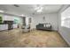 Open floor plan living room with an adjacent dining area at 2121 Dodge St, Clearwater, FL 33760