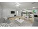 Inviting space with living and dining area, featuring tile floors and a modern aesthetic at 2121 Dodge St, Clearwater, FL 33760