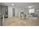 Combined kitchen, dining, and living areas with modern finishes and a cohesive design at 2121 Dodge St, Clearwater, FL 33760