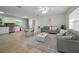 Open-concept living space, featuring a comfortable seating area seamlessly connected to the kitchen at 2121 Dodge St, Clearwater, FL 33760