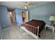 Bedroom featuring tile floors, access to the bathroom and another bedroom, and neutral walls at 2210 Bayou Dr, Holiday, FL 34691