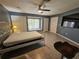 Bedroom featuring tile floors, a ceiling fan, and a bed with a white metal frame at 2210 Bayou Dr, Holiday, FL 34691