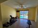 Bonus room featuring sliding door access to a screened-in lanai and pool at 2210 Bayou Dr, Holiday, FL 34691
