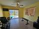 Bonus room with sliding door access to a screened-in lanai and pool at 2210 Bayou Dr, Holiday, FL 34691